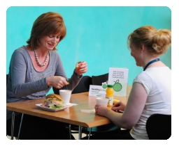 Diners seated enjoying a healthy meal